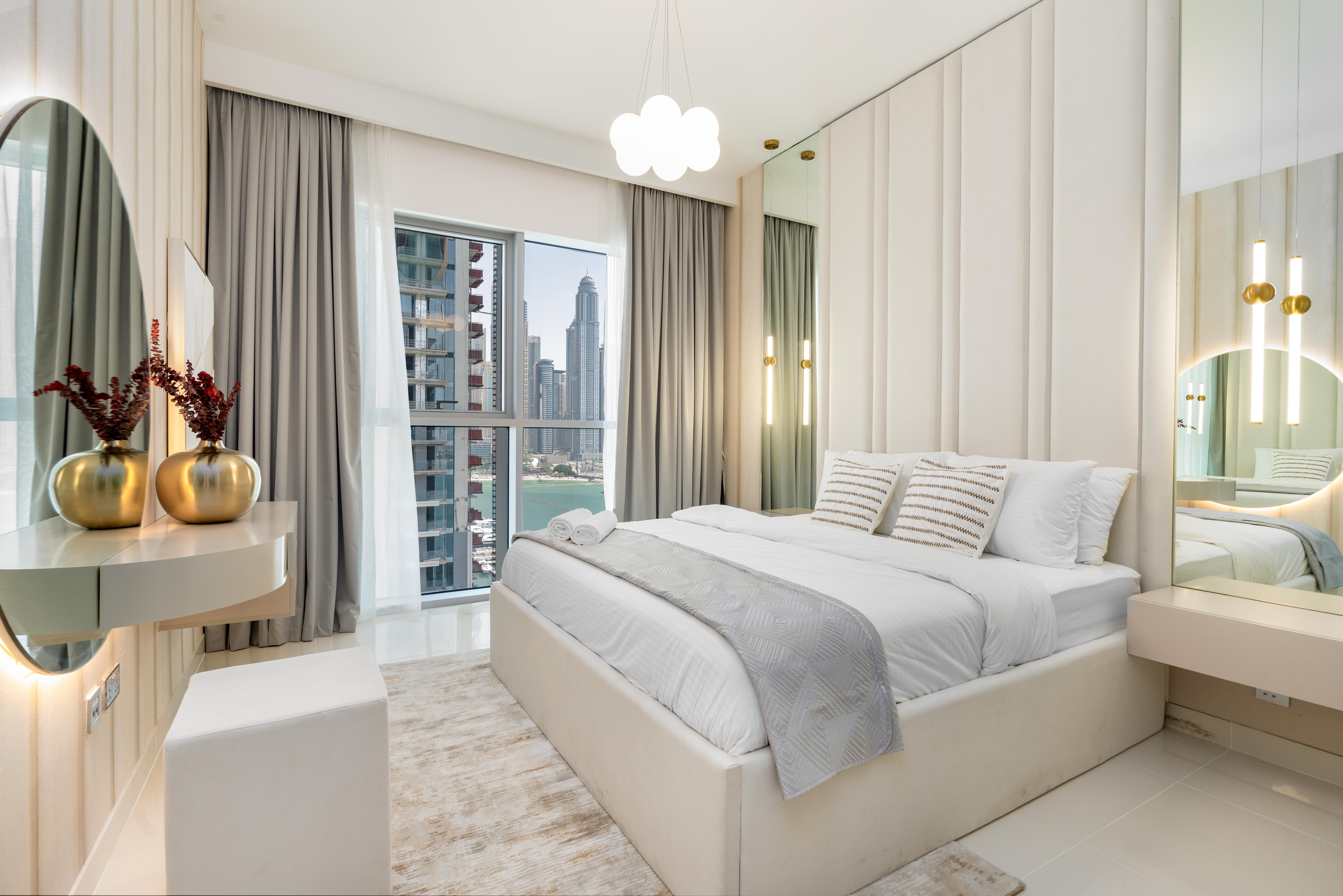 Bedroom suite with city skyline views photography